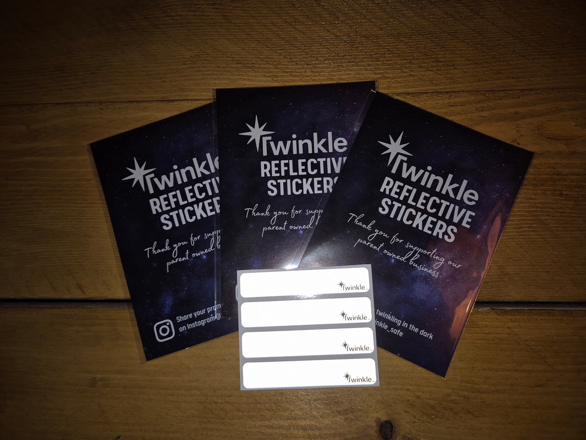 Twinkle Safe reflective pram stickers product packaging showing four stickers and branded card inserts